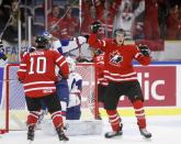 Canada's Anthony Mantha (R) celebrates after scoring on Slovakia during the second period period of their IIHF World Junior Championship ice hockey game in Malmo, Sweden, December 30, 2013. REUTERS/Alexander Demianchuk (SWEDEN - Tags: SPORT ICE HOCKEY)