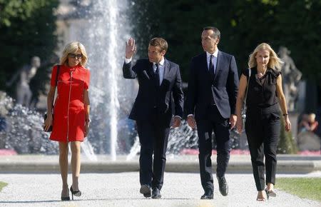 French President Emmanuel Macron and and his wife Brigitte Macron and Austrian Chancellor Christian Kern and his wife Eveline Steinberger-Kern pose for photographers in Salzburg, Austria, August 23, 2017.