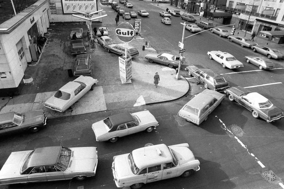 Cars line up in two directions at a gas station in New York City on Dec. 23, 1973. An unhappy confluence of events has economists reaching back to the days of disco and the bleak high-inflation, high-unemployment economy of nearly a half century ago. No one thinks stagflation is in sight. But as a longer-term threat, it can no longer be dismissed.