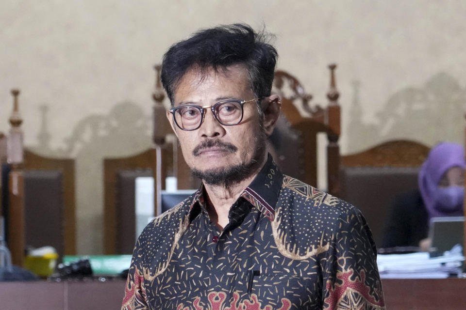 Former Indonesian Agriculture Minister Syahrul Yasin Limpo stands in the courtroom after his sentencing at the Corruption Court in Jakarta, Indonesia Thursday, July 11, 2024. Indonesia's anti-graft court sentenced Limpo to 10 years in prison Thursday after finding him guilty of corruption-related extortion, abuse of power and bribery involving ministry contracts with private vendors. (AP Photo/Tatan Syuflana)