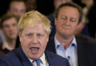 FILE - In this Tuesday, May 3, 2016 file photo Britain's Prime Minister David Cameron, right, listens as then Mayor of London Boris Johnson speaks at a mayoral election campaign rally for Britain's Conservative party candidate for Mayor of London Zac Goldsmith at a school in Ham, a suburb in south west London. (AP Photo/Matt Dunham, File)