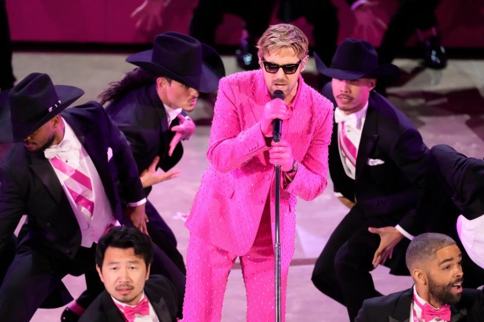 He donned a sparkly pink suit for the performance. Chris Pizzello/Invision/AP