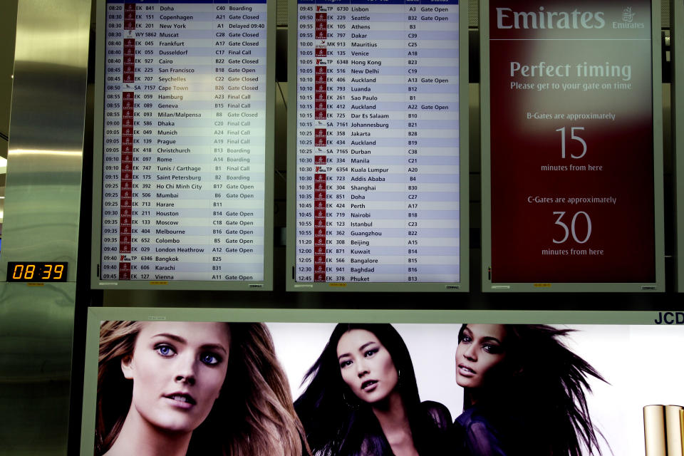 In this Sunday, Feb. 10, 2013, photo, an aircraft departure board shows Emirates airlines' schedule at the new Concourse A of Dubai airport in Dubai, United Arab Emirates. For generations, international fliers have stopped over in London, Paris and Amsterdam. Now, they increasingly switch planes in Dubai, Doha and Abu Dhabi, making this region the new crossroads of global travel. The switch is driven by both the airports and airlines, all backed by governments that see aviation as the way to make their countries bigger players in the global economy. (AP Photo/Kamran Jebreili)