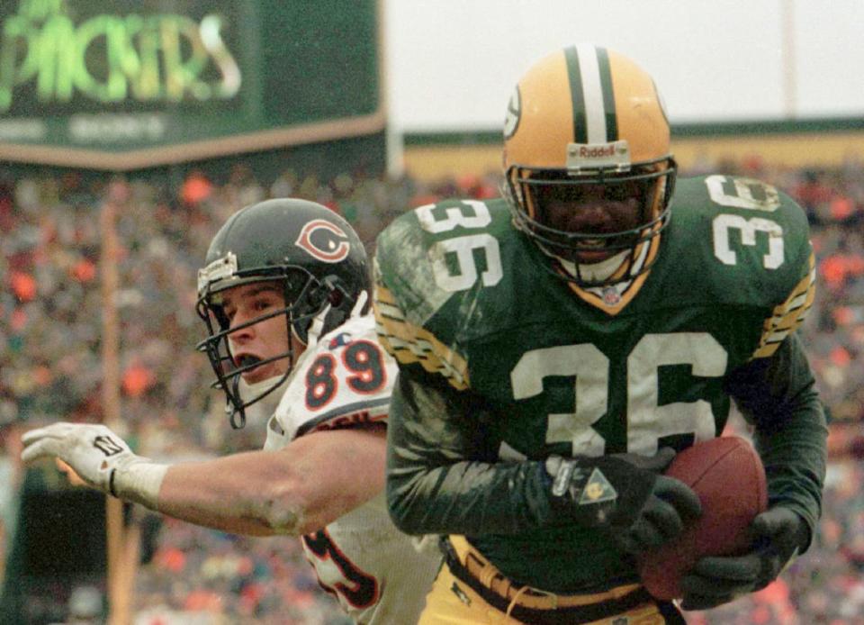 LeRoy Butler grabs an interception for the Packers in front of Ryan Wetnight of the Bears late in the fourth quarter, Nov. 12, 1995, in Green Bay. The Packers won 35-28.
