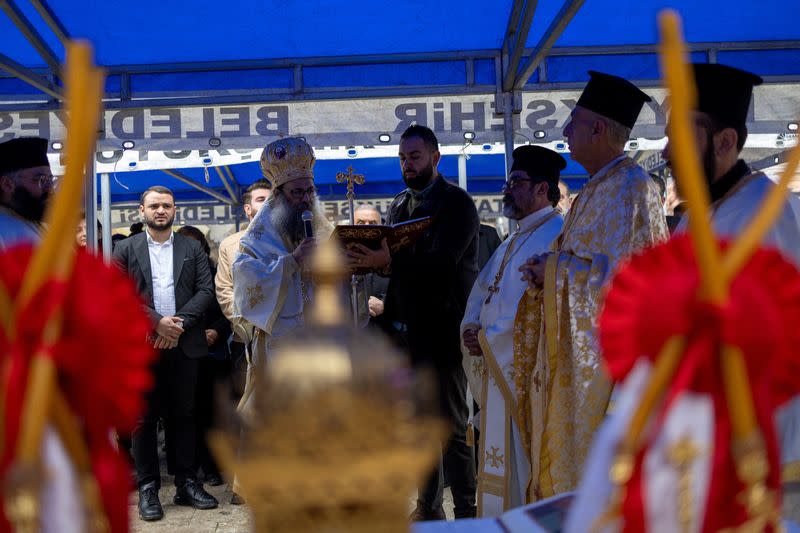 Bishop Arsenios Dahdal conducts a mass for those of their community killed by last year's earthquake at Greek Orthodox Church in Hatay