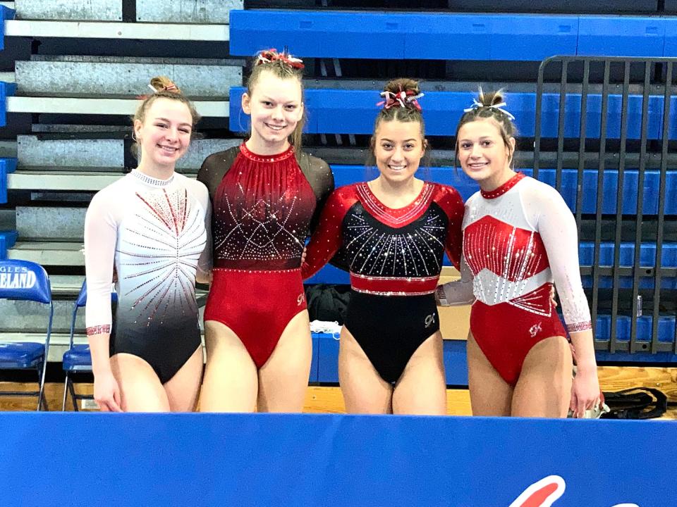 Coldwater's McKenna Hantz (second from right) poses with her teammates at the MHSAA Gymnastics State Finals. Pictured are, from left, Charlotte Calhoun, Randi Dudek, Hantz, and Layla Shoch