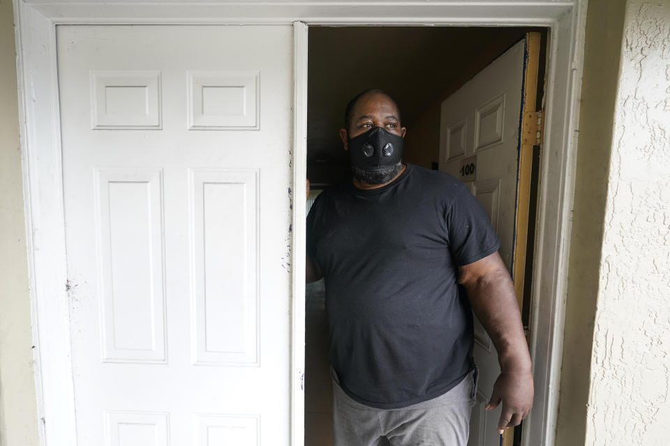 Freddie Davis poses for a photo in his apartment, Monday, June 21, 2021, in Miami. With the federal eviction moratorium extended through July, the focus has turned to getting rental assistance out to millions of tenants. Davis, a truck driver who lost his job during the pandemic and saw his rent increase from $875 to $1,400-a-month. He is $7,000 behind on rent and fears his monthly $1,038 disability check after he lost a leg to diabetes won’t be enough to find another place. He applied for rental assistance but his landlord refused to take it. (AP Photo/Wilfredo Lee)