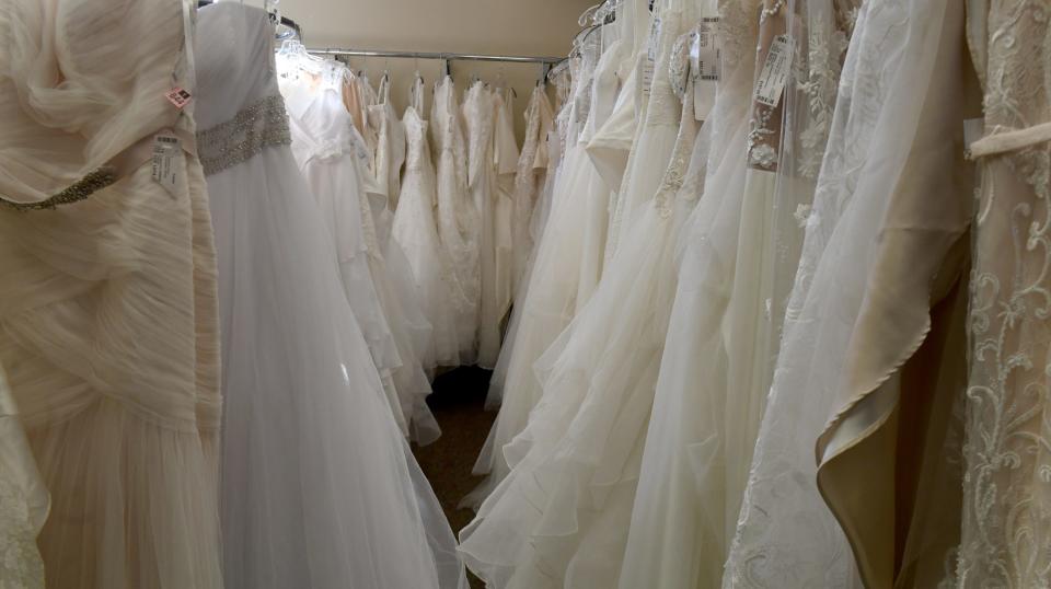 Encore Resale Fashions has racks of wedding dresses in its resale lineup.