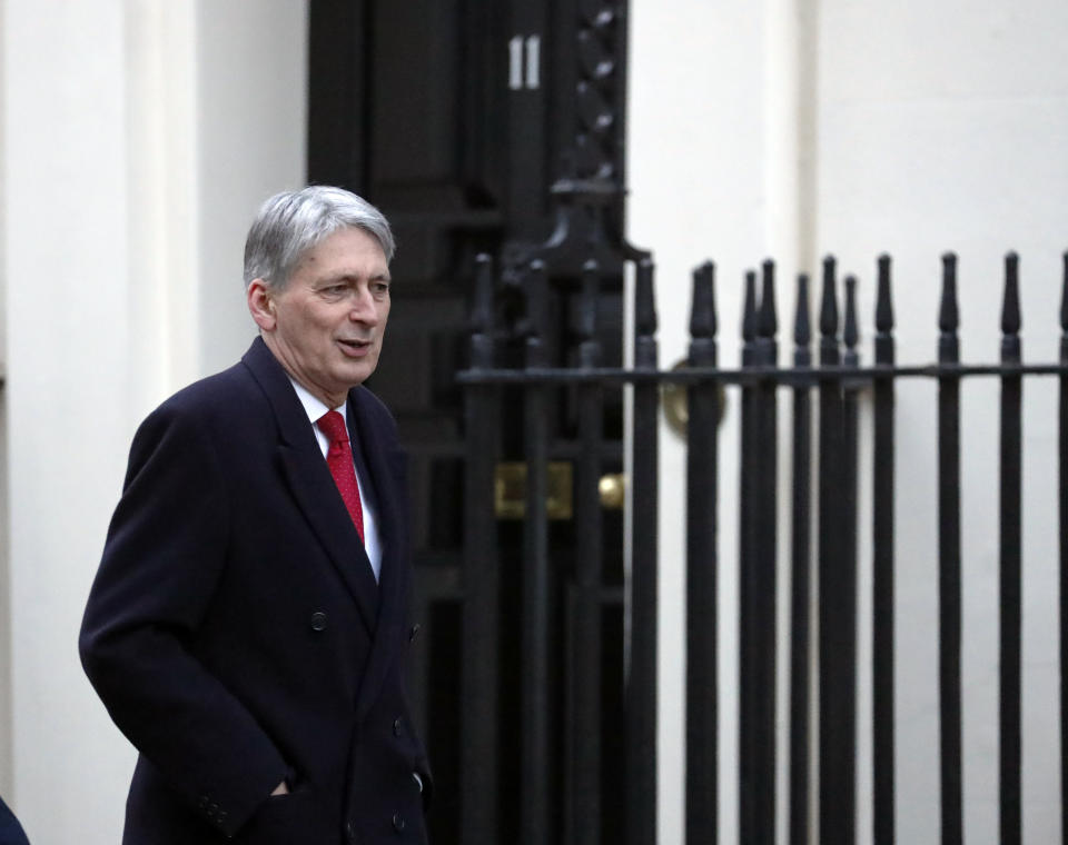 Chancellor of the Exchequer Philip Hammond, arrives at Downing street in London, Thursday Jan. 17, 2019. Britain's Prime Minister Theresa May is reaching out to opposition parties and other lawmakers Thursday in an effort to put Brexit back on track, after surviving a no-confidence vote Wednesday. (AP Photo/Frank Augstein)