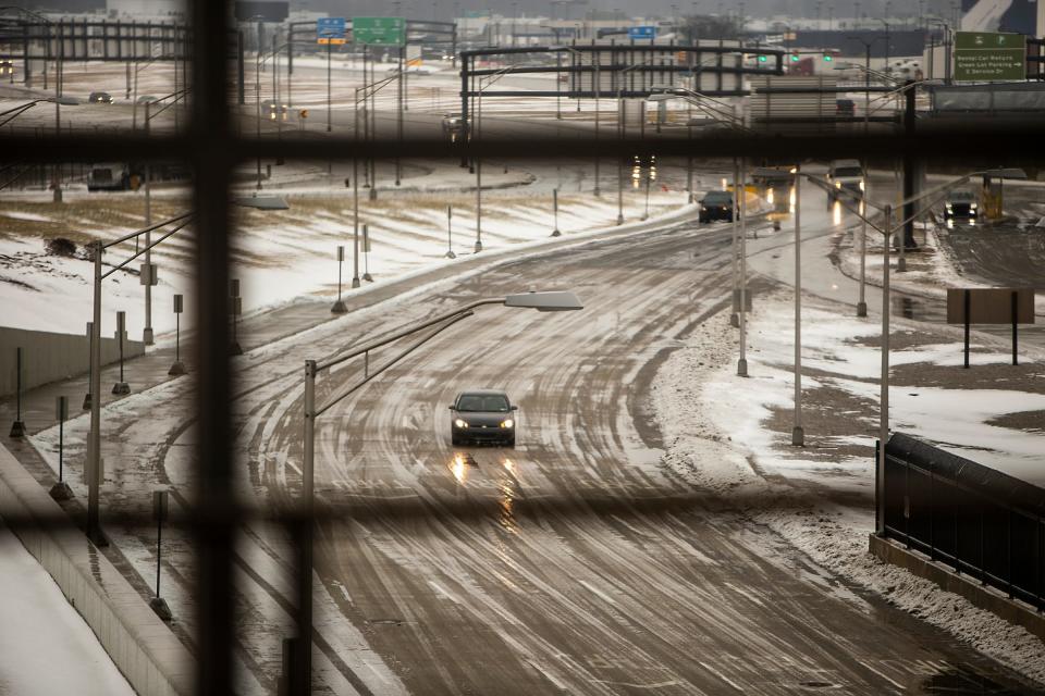 Winter weather can make driving hazardous in well over half the country. Are you and your car ready? A car drives up to the North Terminal on icy roads near Detroit Metro Airport in January 2019.