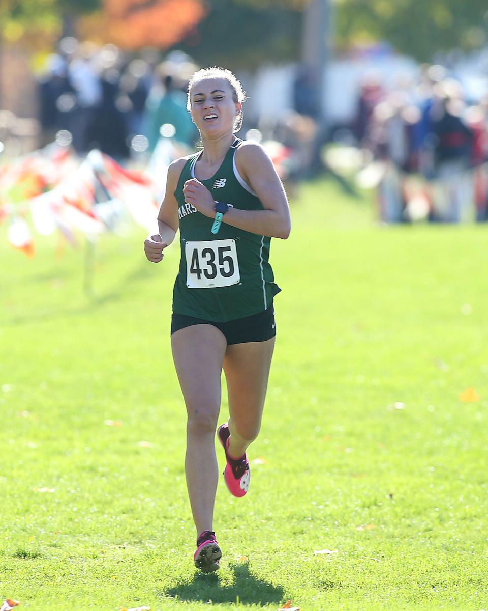 Marshfield’s Ava Lovuolo pushes herself to take fifth overall during the Patriot League Championship meet at Hingham High on Saturday, Oct. 29, 2022. Marshfield girls won with 29 points to Hingham’s 63, while Marshfield boys won with 61 points to Plymouth South’s 67 points. 