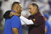 BYU coach Kalani Sitake, left, and Arizona State coach Herm Edwards speak before an NCAA college football game Saturday, Sept. 18, 2021, in Provo, Utah. (AP Photo/Rick Bowmer)