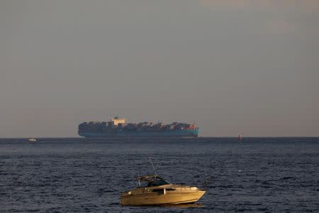 A pleasure boat is seen as a Maersk container ship arrives in New York Harbor in New York City, U.S., June 27, 2017. REUTERS/Brendan McDermid