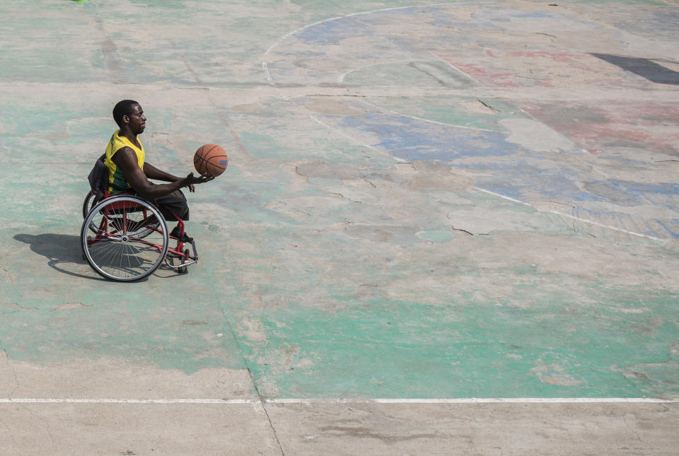 Paul Mitemberezi, a market vendor who has been disabled since he was 3 because of polio, plays basketball at the North Kivu Paralympic League, in Goma, democratic Republic of Congo, Tuesday Jan. 17, 2023. When Pope Francis arrives in Congo and South Sudan Jan. 31, thousands of people will take special note of a gesture more grounded than the sign of the cross. Watching from their wheelchairs, they will relate to the way he uses his. (AP Photo/Moses Sawasawa)