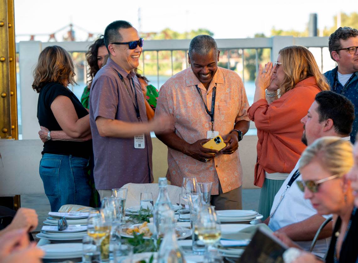 Sacramento City Manager Howard Chan, left, Councilman Rick Jennings and state Sen. Angelique Ashby talk at the Tower Bridge Dinner on Sunday.