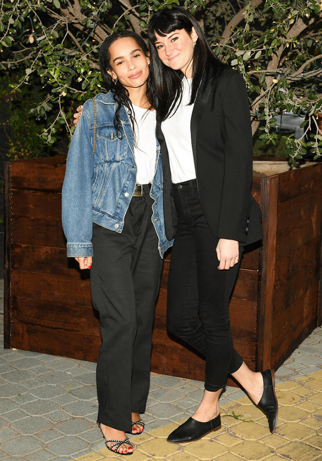 Krysten Ritter braves the rain in a denim jacket and purple leggings while  out for her