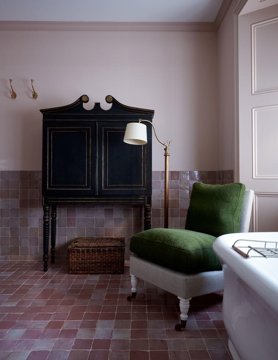 Pink zellige tiles by Emery & Cie offset walls in Farrow & Ball’s Setting Plaster in the master bath.