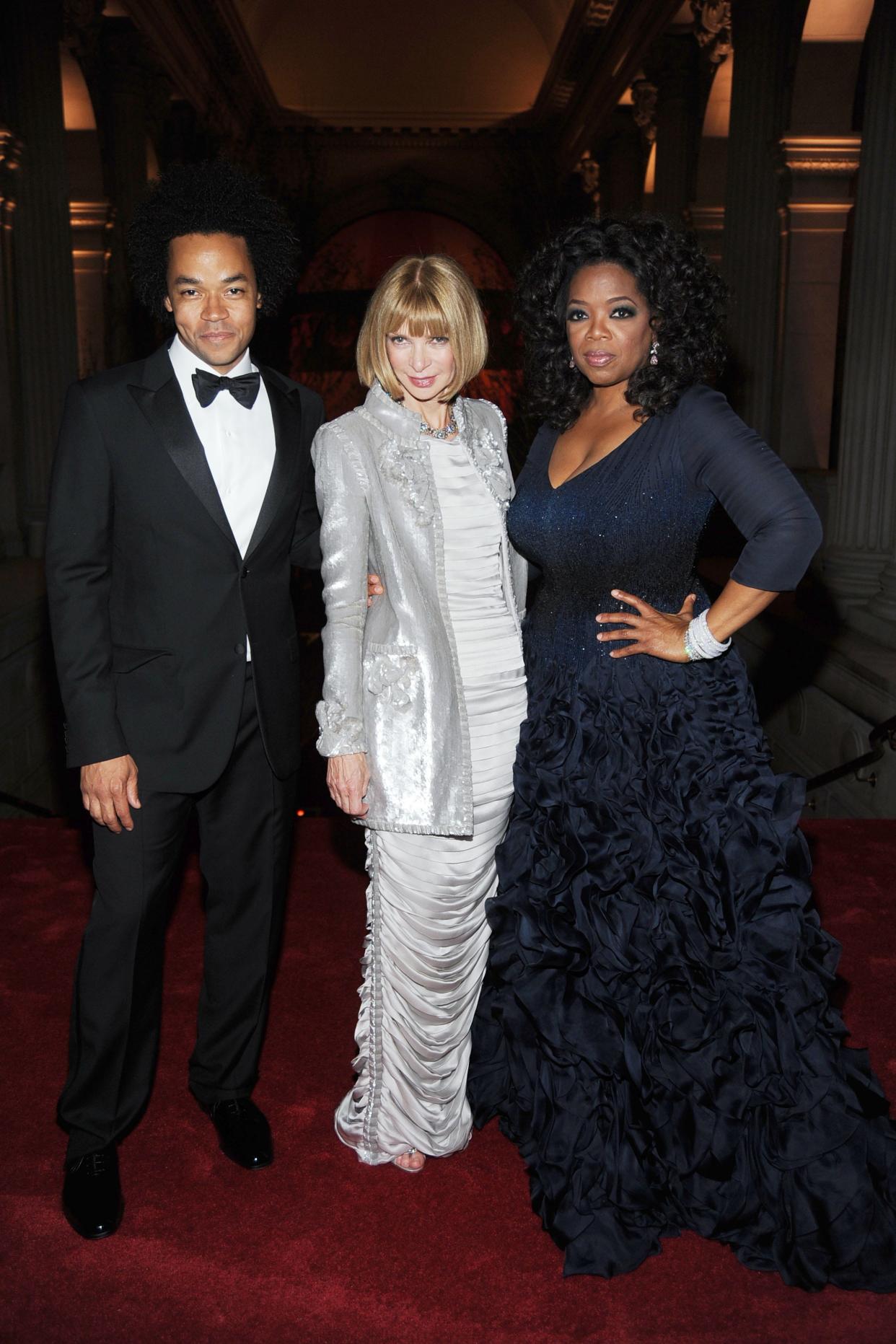 Patrick Robinson, Anna Wintour, and Oprah Winfrey pose on the red carpet at the 2010 Met Gala.