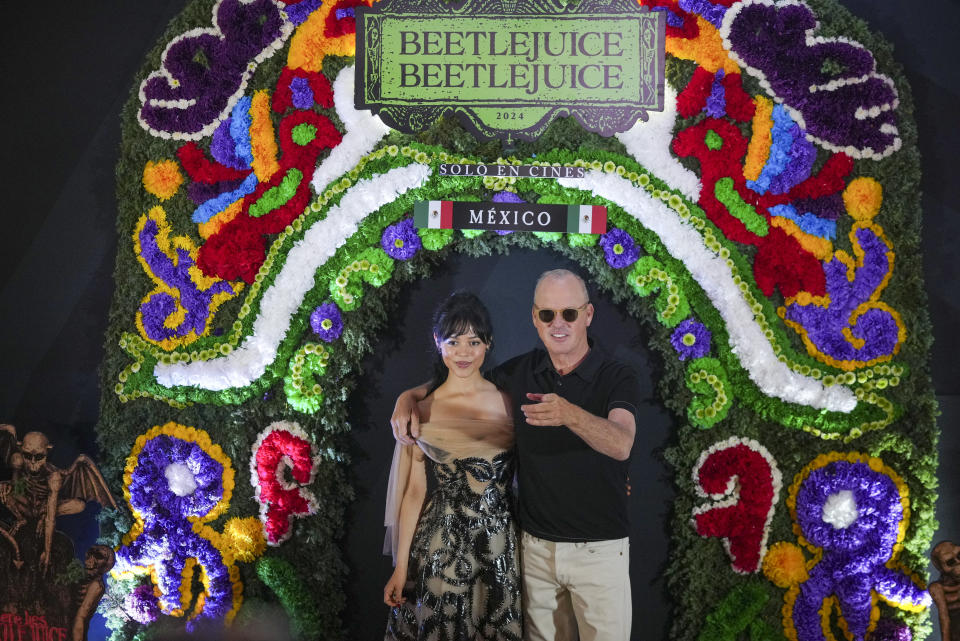 Actors Jenna Ortega and Michael Keaton pose for the photographers during a promotional event for the movie Beetlejuice 2 in Mexico City, Tuesday, Aug. 13, 2024. (AP Photo/Fernando Llano)