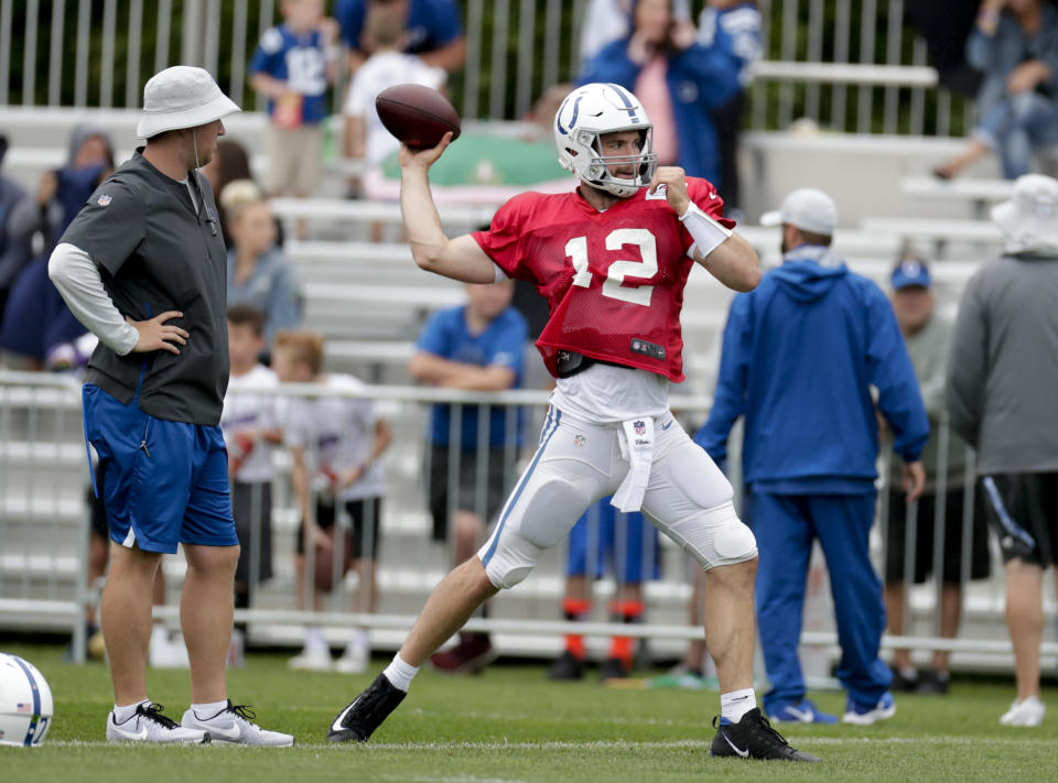 Indianapolis Colts quarterback Andrew Luck (12) throws during practice at the NFL team's football training camp in Westfield, Ind., Sunday, July 29, 2018. (AP Photo/Michael Conroy)