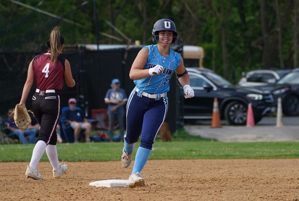 Ursuline's Ava Papaleo (13) rounds second after hitting a 2-run home run during softball action against Harrison at Harrison High School on Wednesday, May 8, 2024.