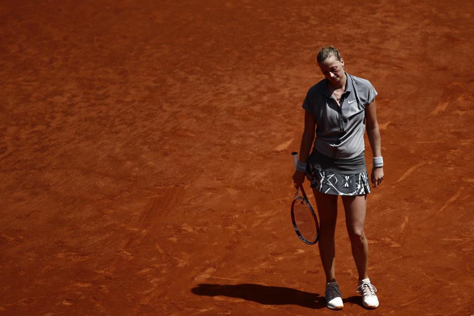 Petra Kvitova from Czech Republic reacts during a Madrid Open tennis tournament match against Simona Halep from Romania in Madrid, Spain, Saturday, May 10, 2014 . (AP Photo/Daniel Ochoa de Olza)