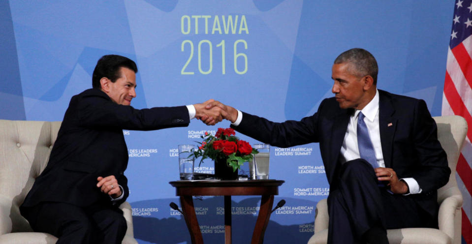 Mexican President Enrique Pena Nieto (L) and U.S. President Barack Obama shake hands at the North American Leaders’ Summit in Ottawa. REUTERS/Kevin Lamarque