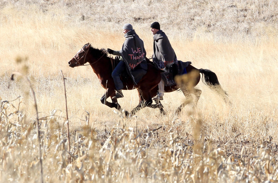 Prince Harry and Prince William ride horses as they arrive to visit a child education centre on June 17, 2010 in Semonkong, Lesotho.