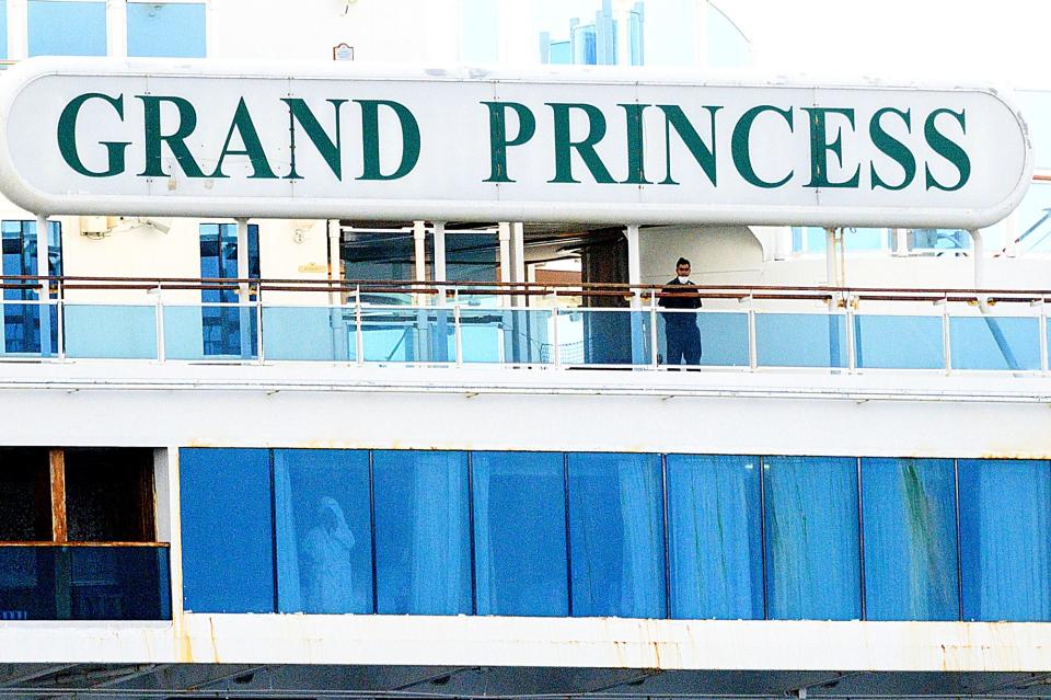 11 A man wears a mask aboard the Grand Princess as it maintains a holding pattern about 25 miles off the coast of San Francisco on Sunday, March 8, 2020. 