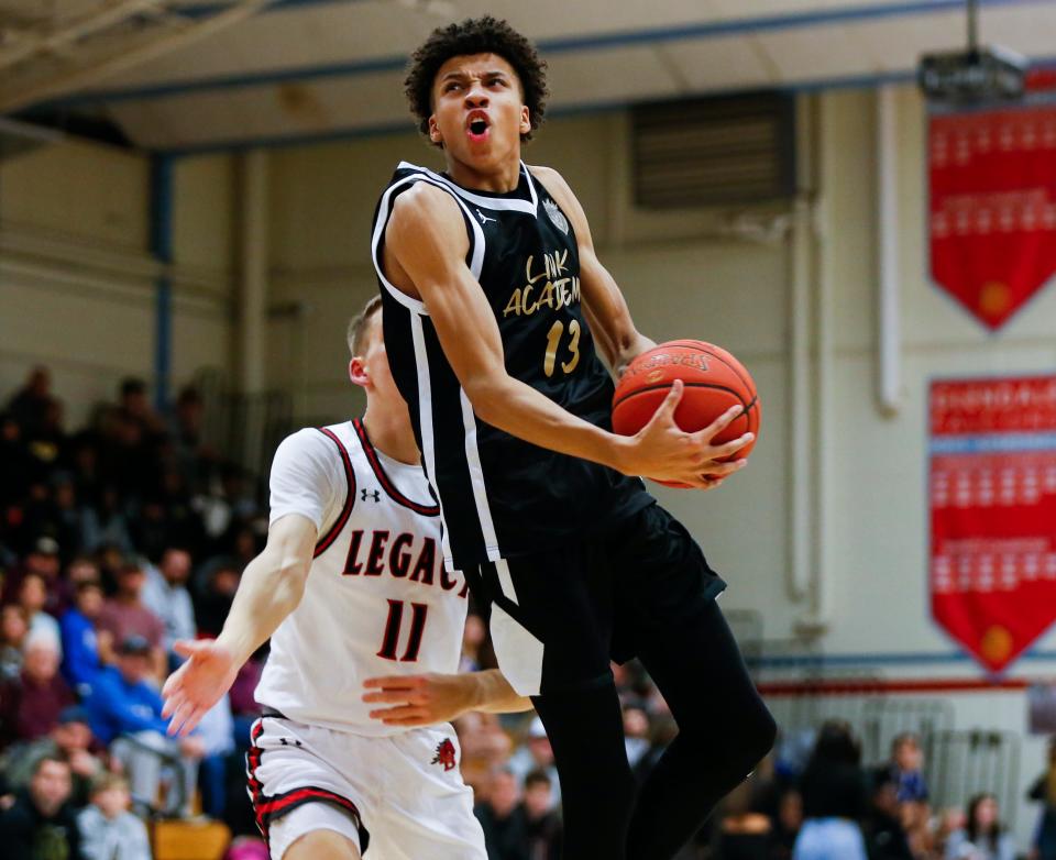 Cameron Carr, of Link Academy, goes to the basket during a game against the Legacy (Texas) Broncos in the Ozark Mountain Shootout at Glendale High School on Thursday, Dec. 8, 2022.