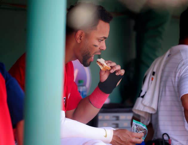 There's a reason athletes like Xander Bogaerts snack on peanut butter and jelly sandwiches mid-game — its combination of macronutrients can help keep your blood glucose stable. (Photo: Boston Globe via Getty Images)