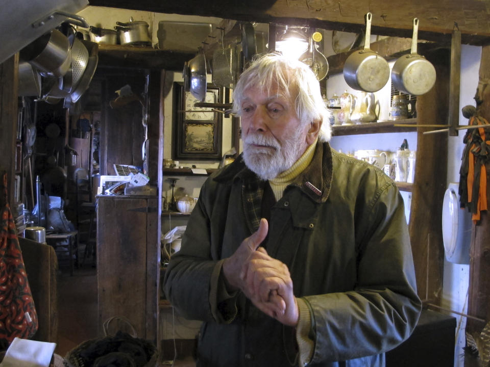 FILE - In this Jan. 3, 2019 file photo, Edward Cook, widower of the late herbalist Adelma Grenier Simmons, stands inside the 18th century home at the Caprilands herb farm in Coventry, Conn. An appeals court has temporarily stopped the eviction of Cook, the widower of famed herbalist Adelma Grenier Simmons from her once-acclaimed Connecticut farm after agreeing to hear his case. The state Appellate Court issued the ruling Wednesday, Jan. 16,just four days before the deadline set by a lower court judge forCook to leave the Coventry farm and remove animals and other items. (AP Photo/Dave Collins, File)