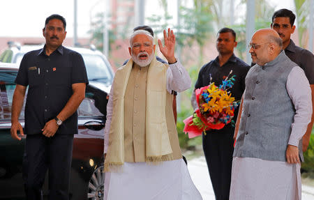 India's Prime Minister Narendra Modi waves to the media as he arrives to attend a thanksgiving ceremony by Bharatiya Janata Party (BJP) leaders to its allies at the party headquarters in New Delhi, India, May 21, 2019. REUTERS/Anushree Fadnavis