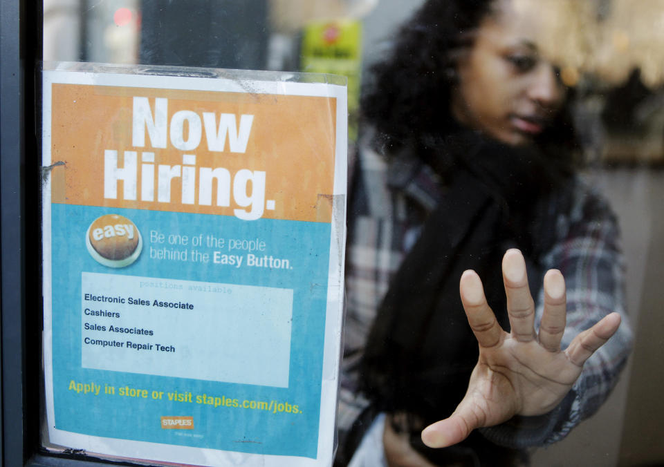 A woman opens a glass door with a "Now Hiring" sign on it as she enters a Staples store in New York March 3, 2011.  New U.S. claims for   unemployment benefits fell last week to their lowest level in   more than 2-1/2 years, signalling an acceleration in job   creation could be taking shape.       REUTERS/Lucas Jackson (UNITED STATES - Tags: EMPLOYMENT BUSINESS)