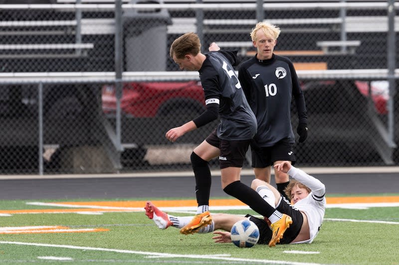 Murray Spartans Jason Adams (5) dribbles the ball over Park City Miners Jay Sykes (15) during a game at Murray High School in Murray on Friday, April 5, 2024.