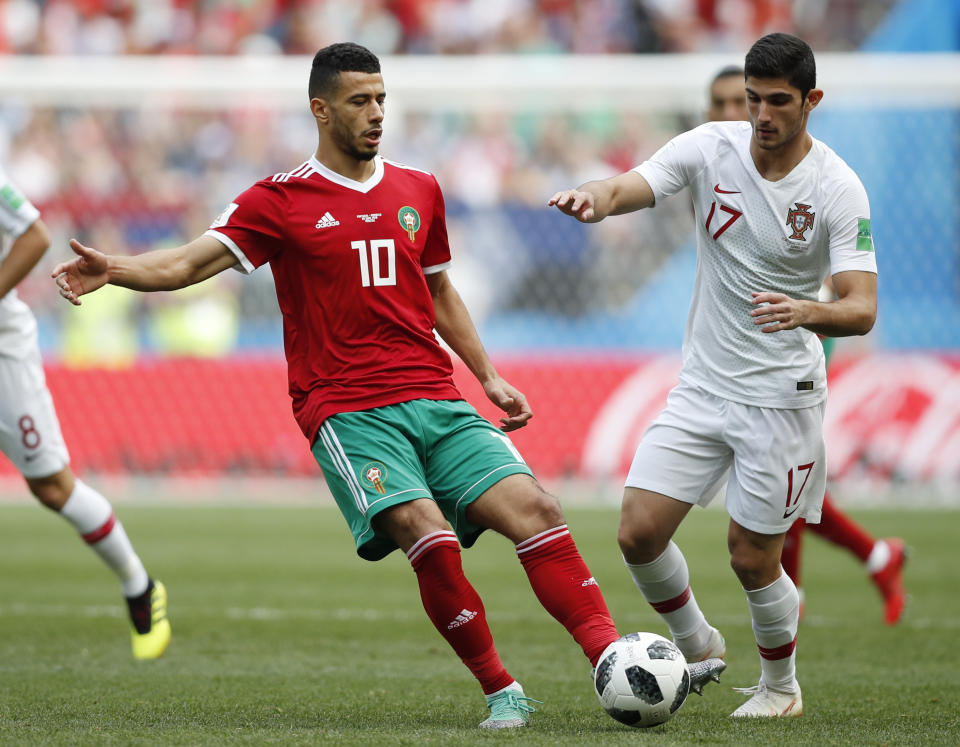 <p>Portugal’s Goncalo Guedes, right, challenges Younes Belhanda </p>