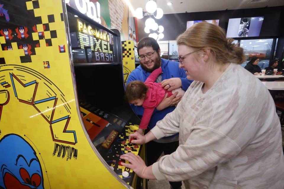 Customers play games at the Peter Piper Pizzeria soft opening on March 8 in Olathe.