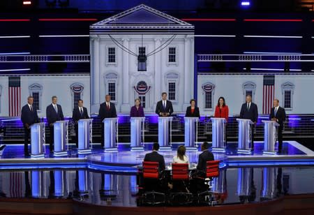 Candidates stand before the start of the first U.S. 2020 presidential election Democratic candidates debate in Miami, Florida, U.S.,