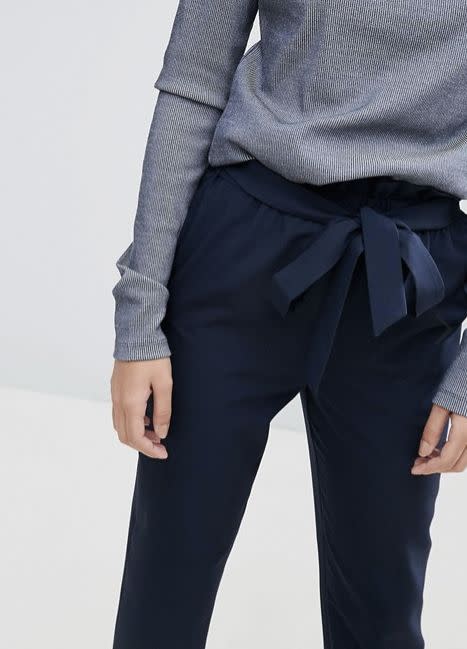 <a href="http://us.asos.com/asos/asos-high-waisted-paper-bag-pants/prd/7818449?clr=navy&amp;SearchQuery=paper+bag+pant&amp;pgesize=10&amp;pge=0&amp;totalstyles=10&amp;gridsize=3&amp;gridrow=1&amp;gridcolumn=1" target="_blank">Shop them here</a>.&nbsp;