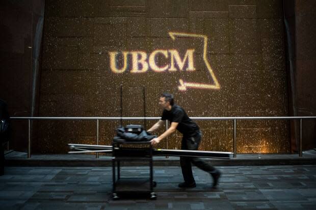 A man pushes a cart at Canada Place during the first day of the UBCM in Vancouver in 2019, the last year the event was held in person.  (Ben Nelms/CBC - image credit)
