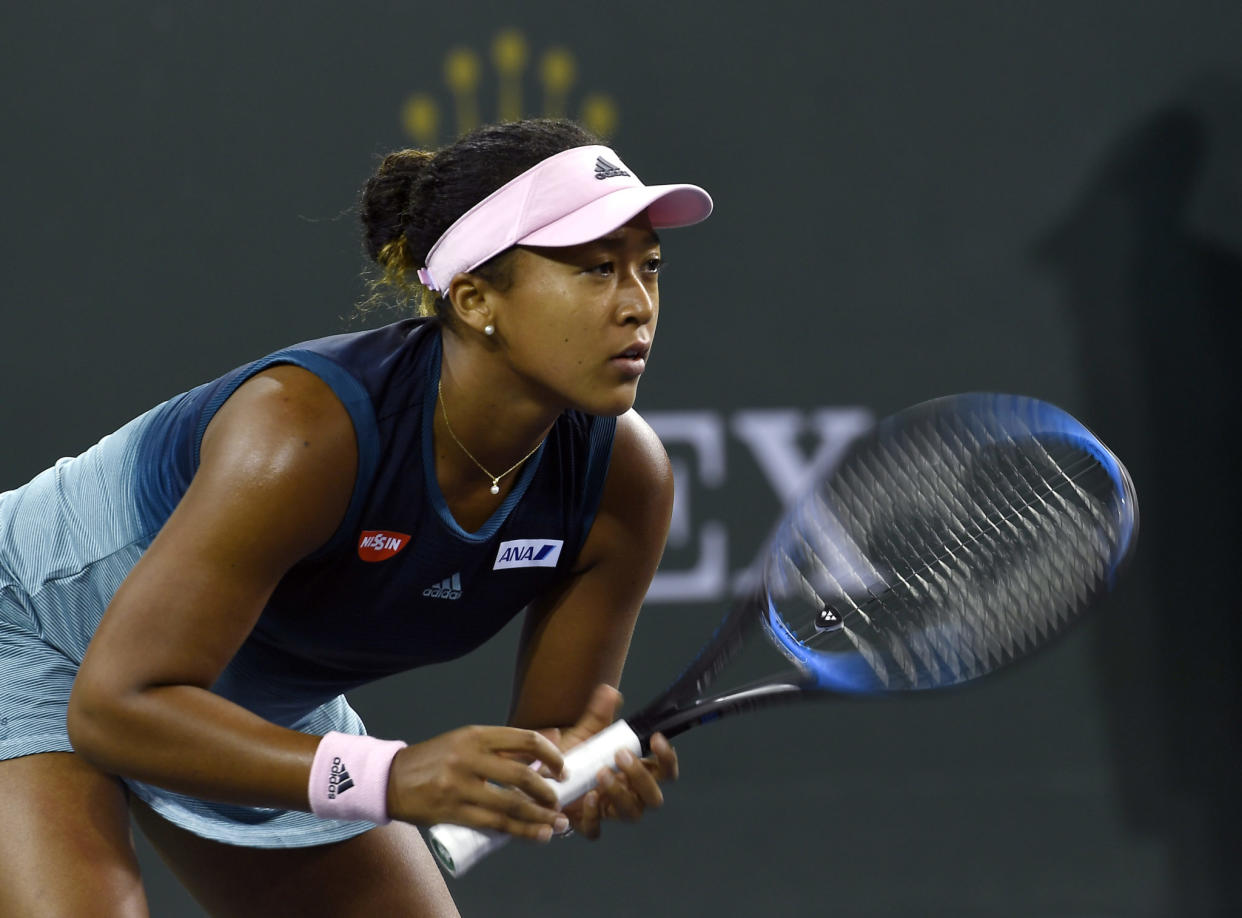 Naomi Osaka playing tennis.