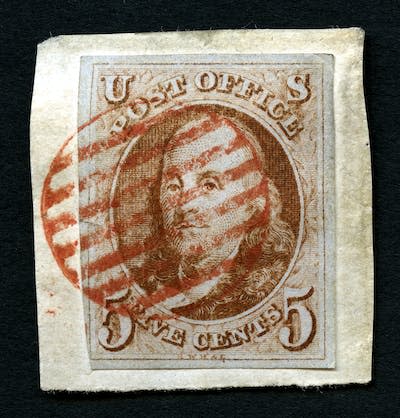 The 1847 Benjamin Franklin stamp. <a href="https://www.gettyimages.com/detail/news-photo/5c-franklin-single-july-1-1847-used-with-red-seven-bar-grid-news-photo/1338660128?adppopup=true" rel="nofollow noopener" target="_blank" data-ylk="slk:Heritage Images/Hulton Archive via Getty Images;elm:context_link;itc:0;sec:content-canvas" class="link ">Heritage Images/Hulton Archive via Getty Images</a>
