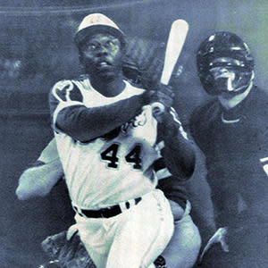 Hank Aaron of the Atlanta Braves hits his 715th career home run, April 8, 1974, at Atlanta-Fulton County Stadium in Atlanta.  / Credit: Sporting News via Getty Images