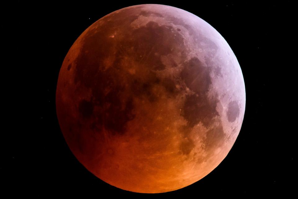 The super blood wolf moon is seen during a total lunar eclipse near Salgotarjan, northeast of Budapest, Hungary.
