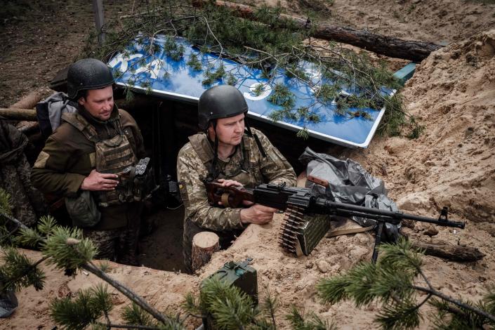 Ukrainian soldiers rest at their position near Lyman, eastern Ukraine, on April 28, 2022, amid Russian invasion of Ukraine.