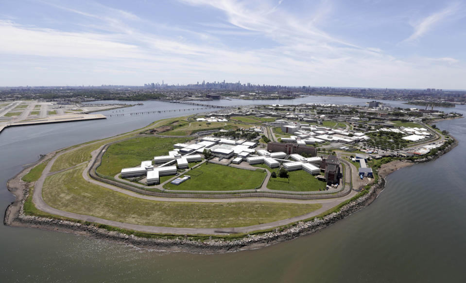 FILE - In this June 20, 2014, file photo, New York City's Rikers Island jail complex, center, is seen with LaGuardia Airport on the upper left, and the Manhattan skyline in the background at center. A commission urging the city to close the massive jail complex says an option for reusing the space could be a new runway and terminal extension of LaGuardia Airport, which last year had by far the highest rate of late-arriving flights of any of the nation's 29 biggest airports. (AP Photo/Seth Wenig, File)