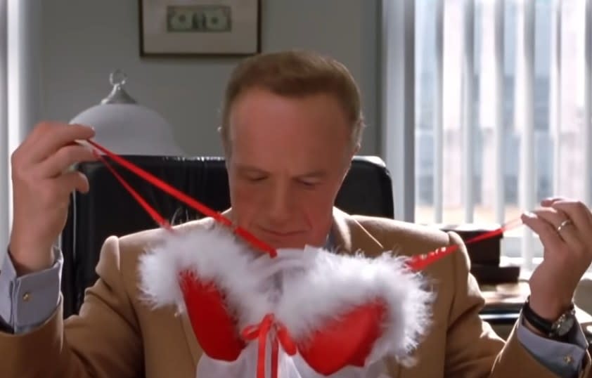 James Caan as Walter looking at a piece of lingerie that was gifted to him