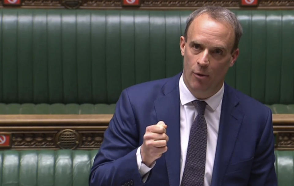 In this grab taken from video, Britain's Foreign Secretary Dominic Raab, standing in for Prime Minister Boris Johnson, speaks, during Prime Minister's Questions in the House of Commons, London, Wednesday April 29, 2020. Johnson's partner Carrie Symonds gave birth to a baby boy on Wednesday morning. (House of Commons/PA via AP)