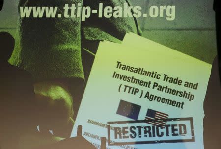 A copy of the leaked TTIP negotiations is projected to a screen during a news conference of the environmental campaign group Greenpeace in Berlin, Germany, May 2, 2016. REUTERS/Fabrizio Bensch