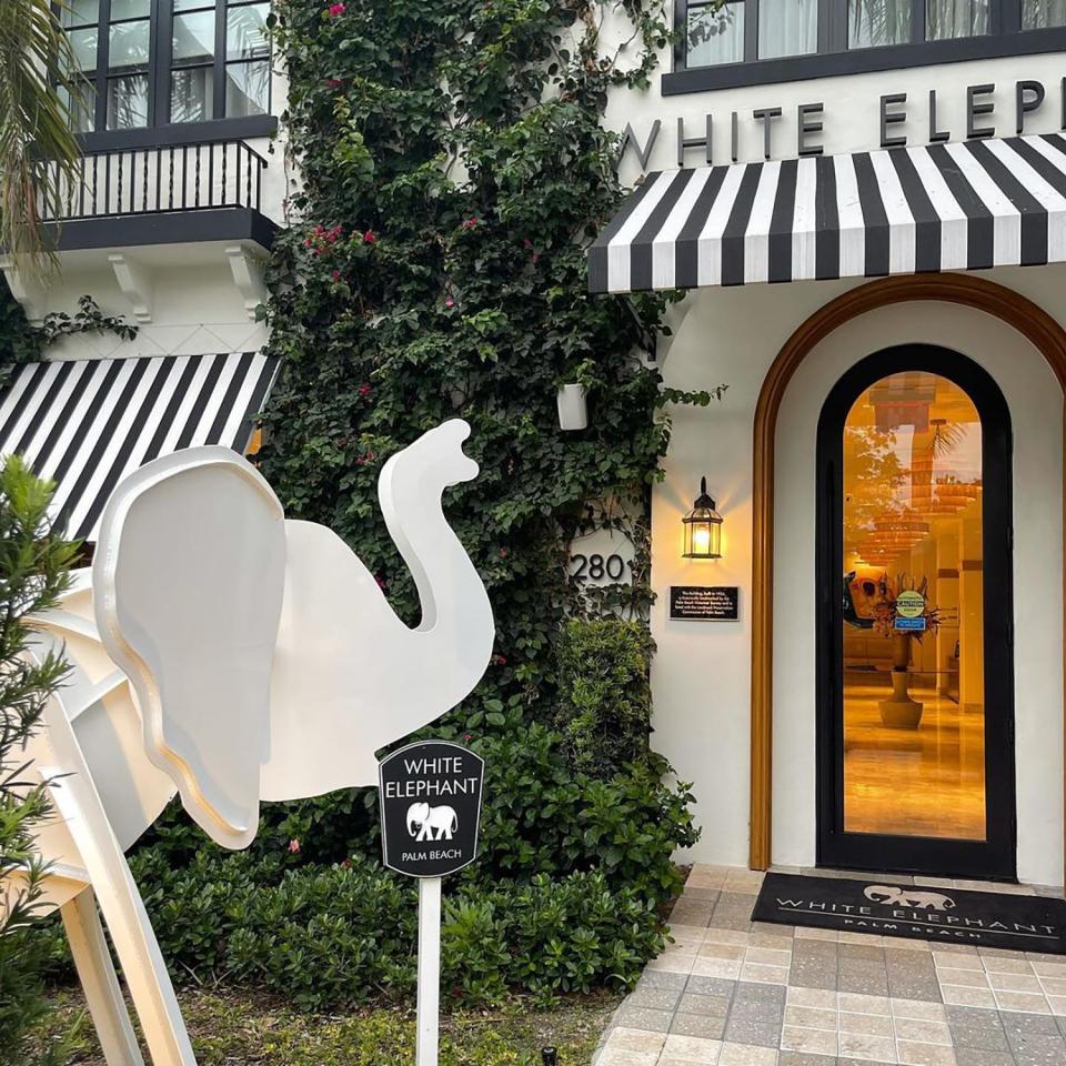 A 7-foot-tall white elephant sculpture by Frederick Prescott stands at the entrance to The White Elephant hotel in Palm Beach.